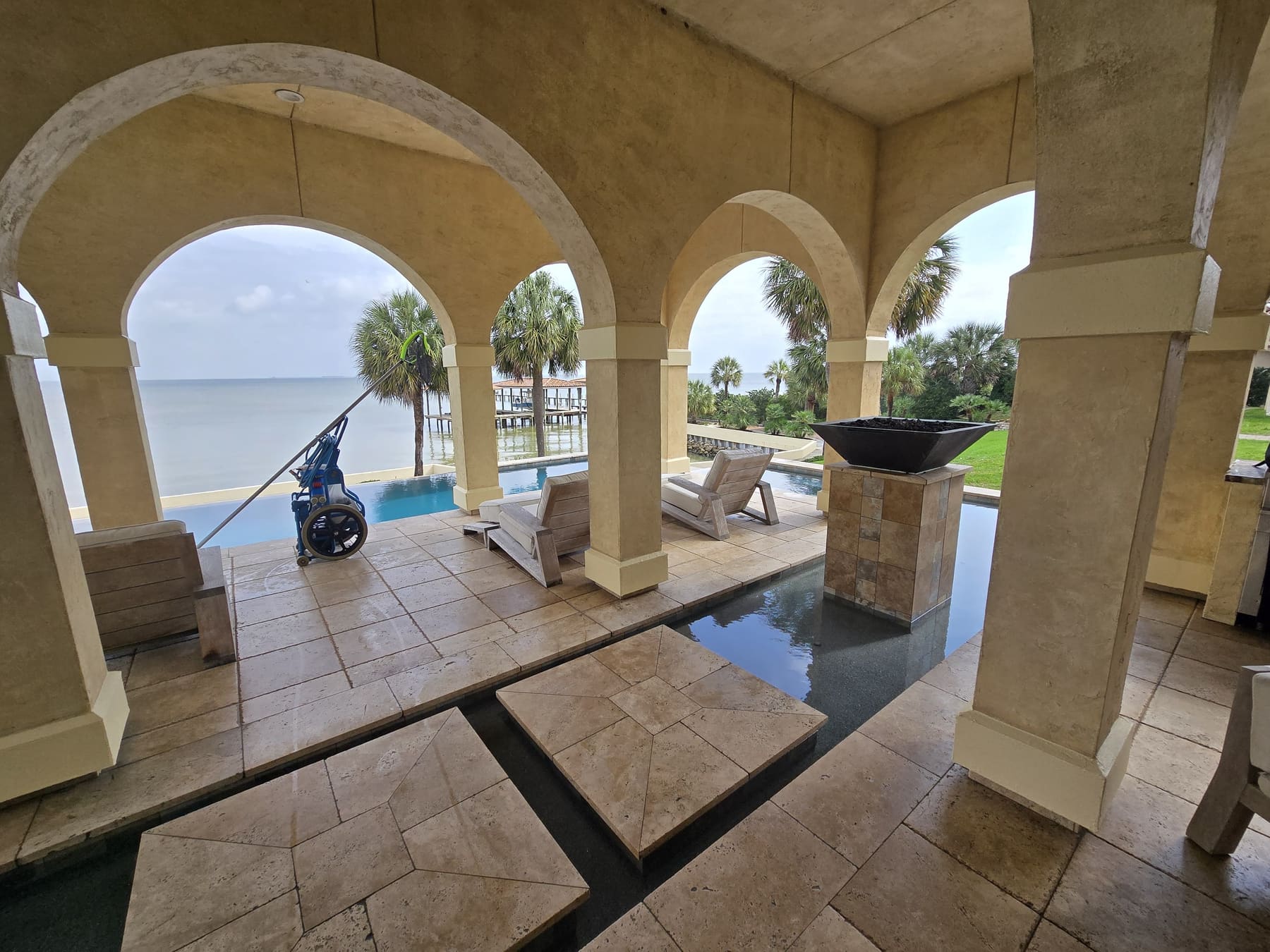 Bayfront pool and patio kept swim-ready by Pelagic Pools
